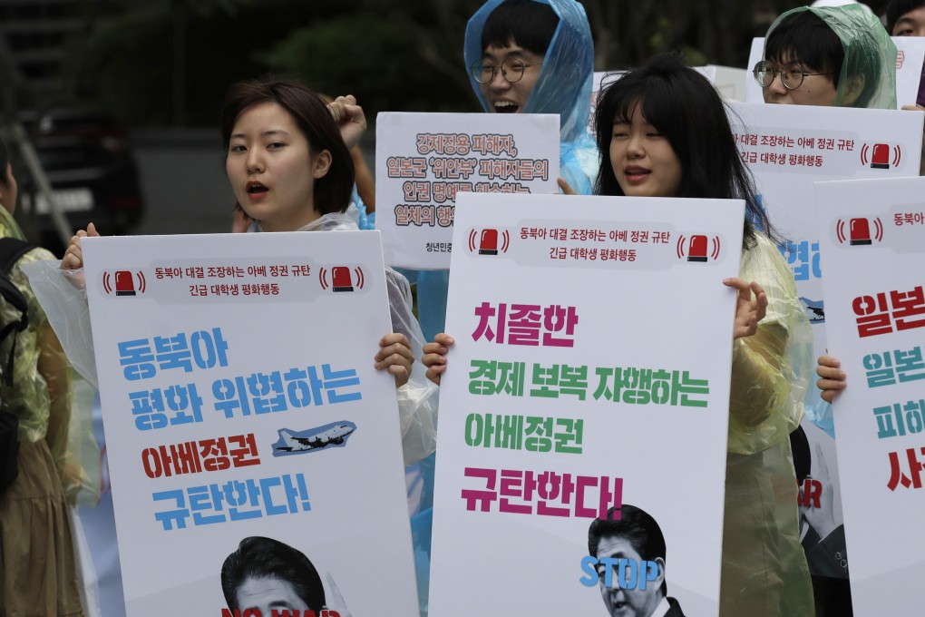 South Korean students protest near the Japanese embassy in Seoul after Japanese officials questioned the credibility of Seoul’s sanctions against North Korea while justifying Tokyo’s stricter controls on hi-tech exports to South Korea. Photo: AP
