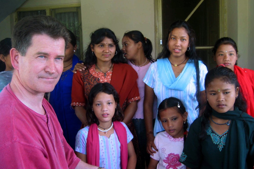 Philip Holmes with some of the Nepali children he rescued from slavery in an Indian circus. Photo: Thomas Bell