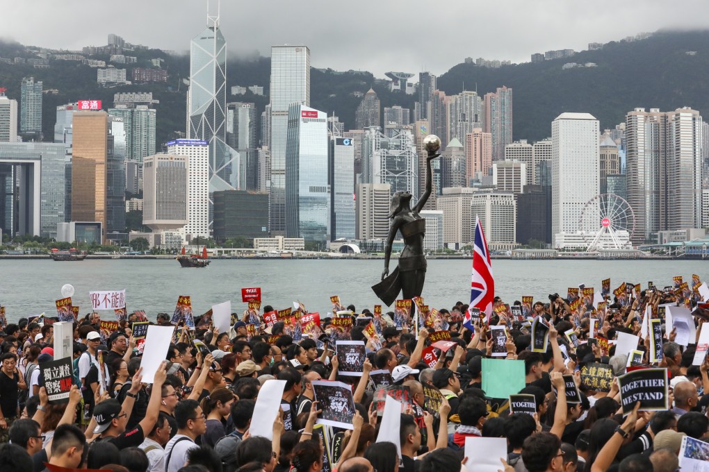 Anti-extradition bill protesters in Tsim Sha Tsui march to the high-speed rail link terminus in West Kowloon on July 7. Photo: Felix Wong