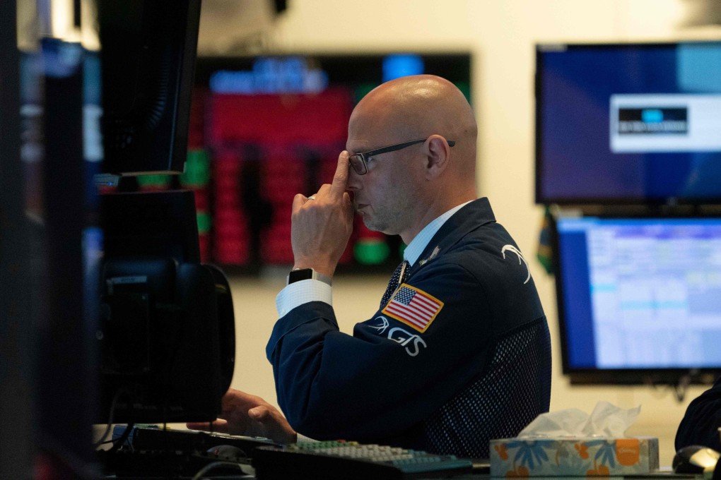 A traders works on the floor of the New York Stock Exchange on July 8. Stocks have bounced back spectacularly from their slump in late 2018. Photo: AFP