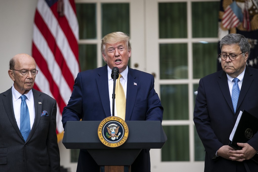 US President Donald Trump speaks as Wilbur Ross, US commerce secretary, left, and William Barr, US attorney general, right, listen during an event about the 2020 census. Photo: Bloomberg
