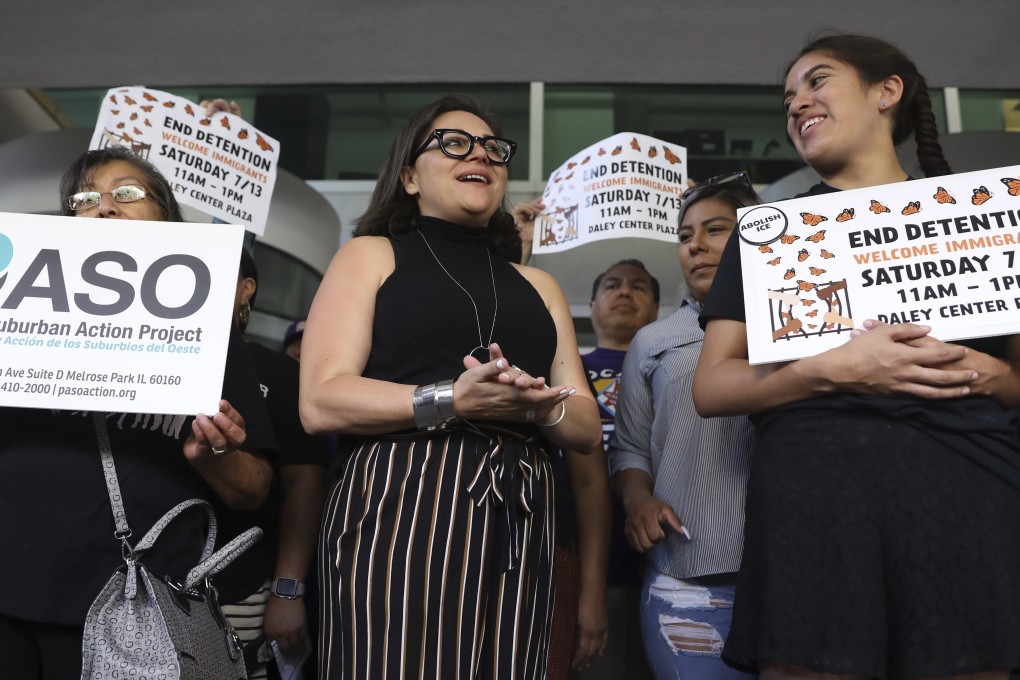 Mony Ruiz-Velasco (centre) director of PASO West Suburban Action Project, chants with demonstrators outside the US Citizenship and Immigration Services offices in Chicago on Thursday. Photo: AP
