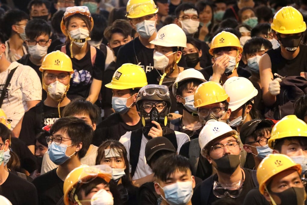 Protesters gather outside police headquarters in Wan Chai on June 21 during a siege that lasted 15 hours. Photo: Felix Wong