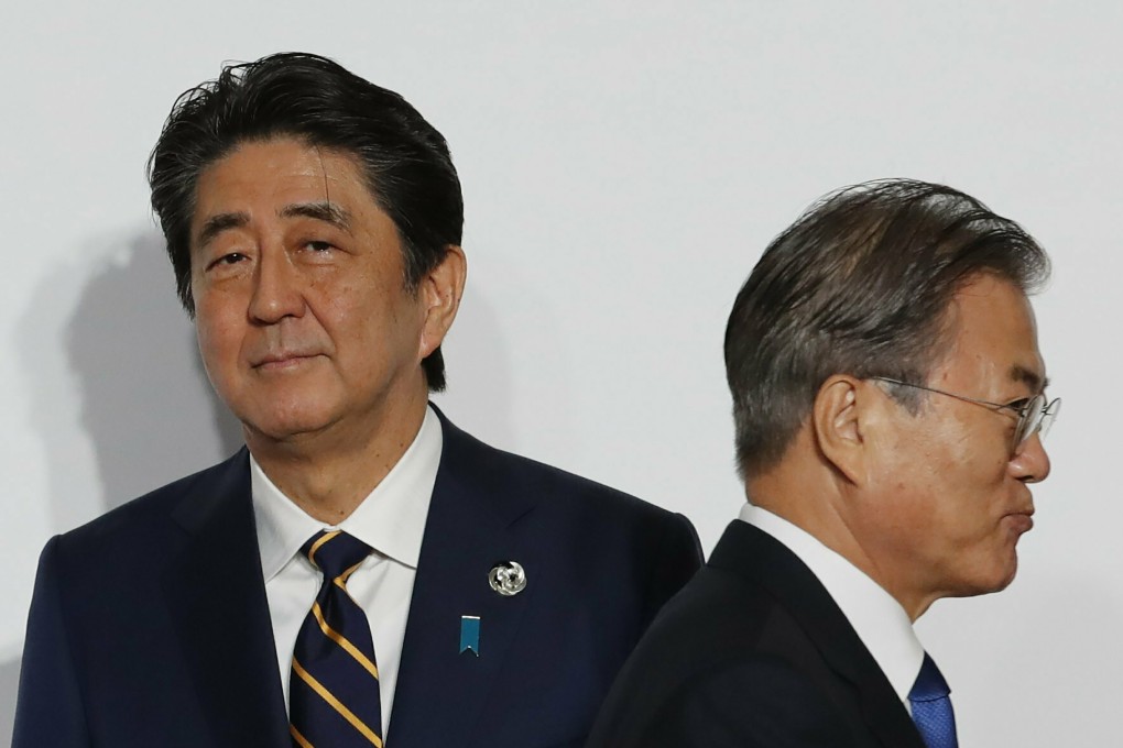 South Korean President Moon Jae-in walks away from Japanese Prime Minister Shinzo Abe. Russia has offered to supply key materials to South Korea to make semiconductors. Photo: AP