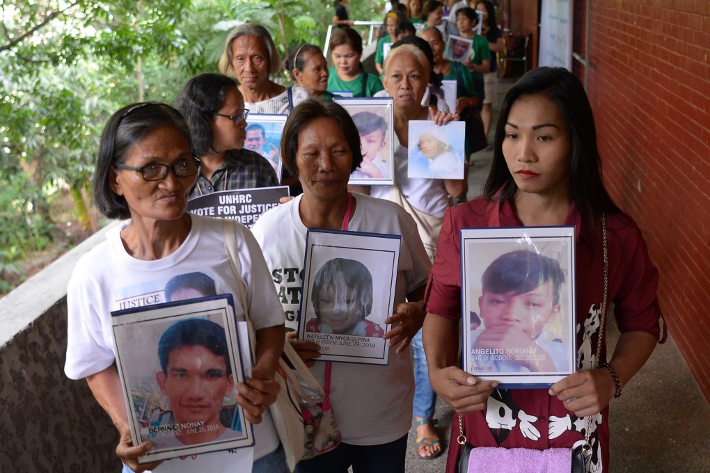 Relatives of drug war victims at a memorial mass in Manila on July 9, 2019. Photo: AFP