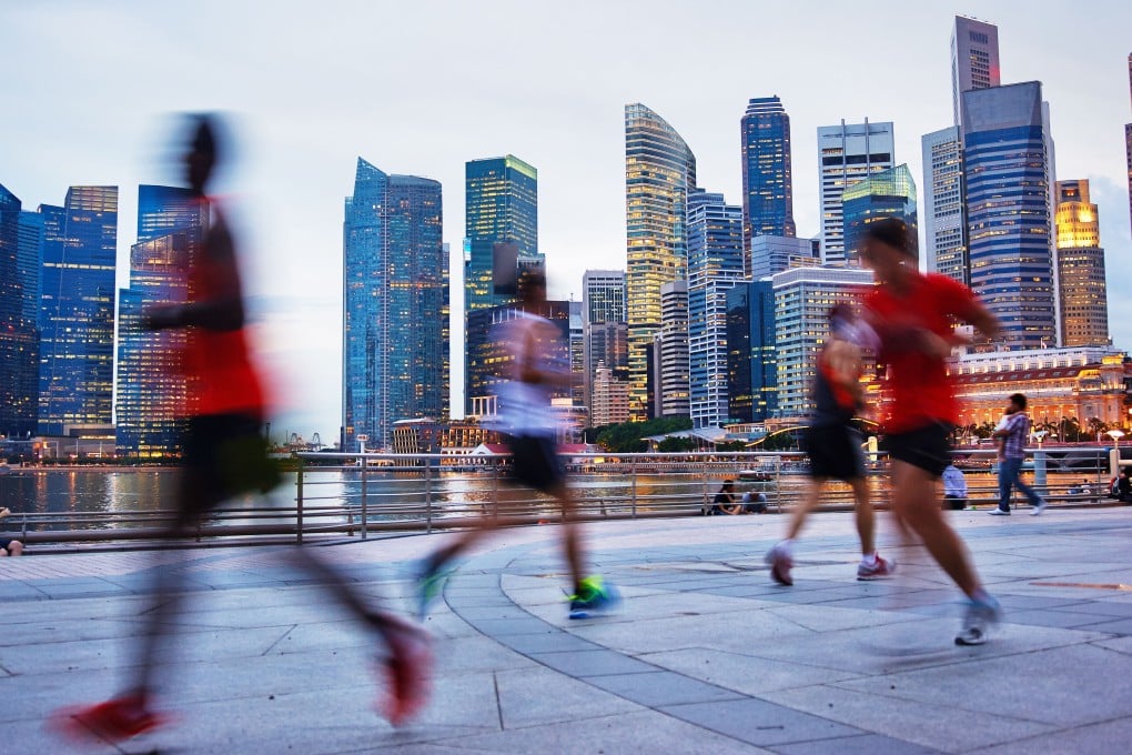 Runners go for an evening jog in Singapore. The Lion City is a popular destination for running tours. Photo: Alamy