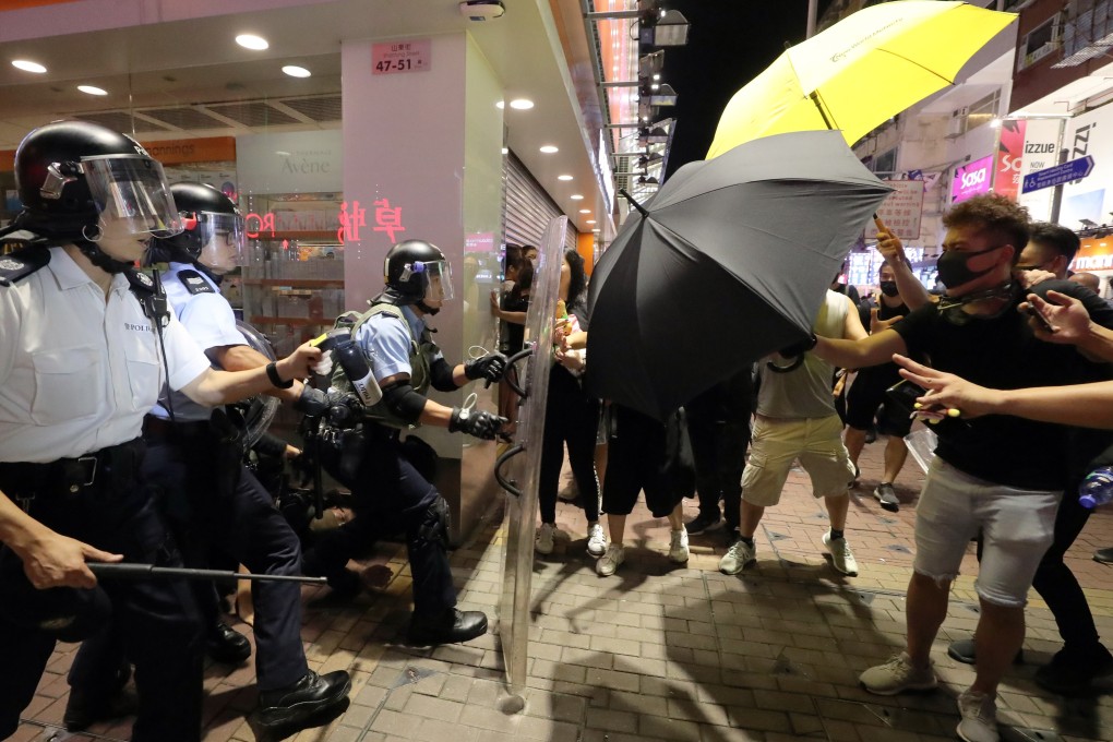 Protesters clash with police officers in Mong Kok following an anti-extradition bill march on July 7. Photo: Sam Tsang