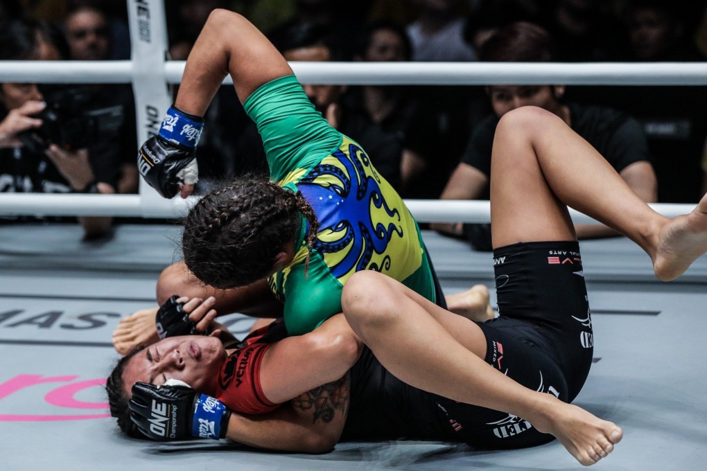 Michelle Nicolini punches Angela Lee on the ground. The Brazilian got a unanimous decision win in Kuala Lumpur. Photos: One Championship
