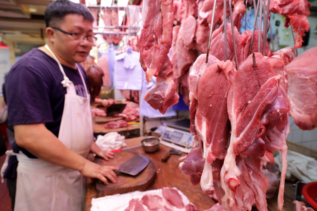 A butcher on Saturday at Sha Tin Market, where in the past week the price for pork reached HK$4,400 per picul, a traditional Chinese unit of about 60kg. Photo: May Tse
