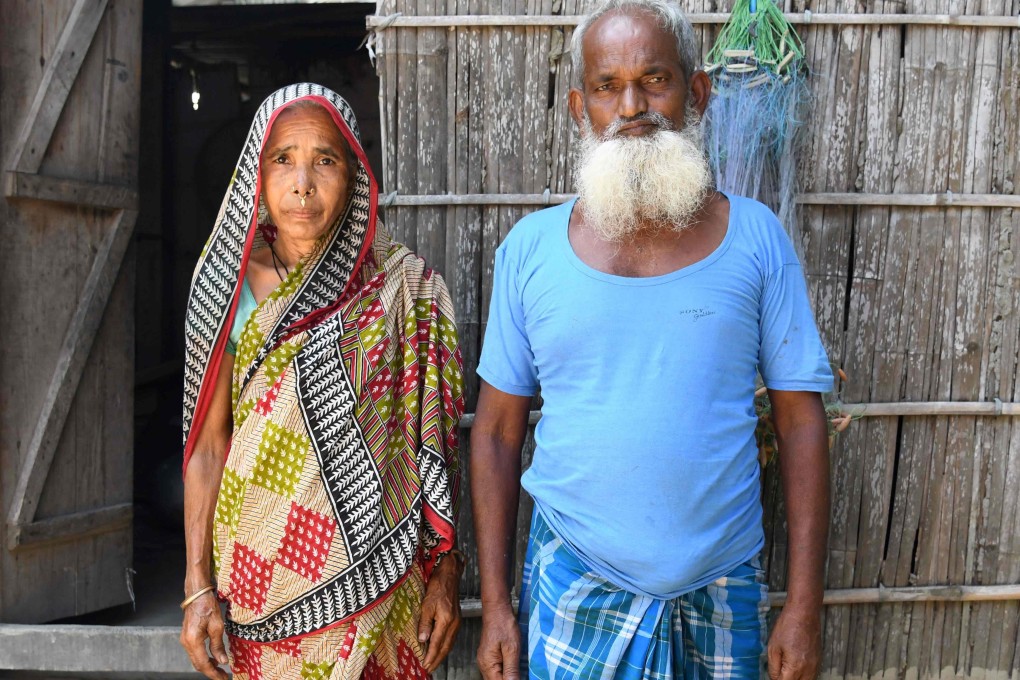 Mohammed Rehat Ali (right), 71, one of many to fall foul of a citizenship process in the north-eastern Indian state of Assam, stands with his wife Joiful Begum. Photo: AFP