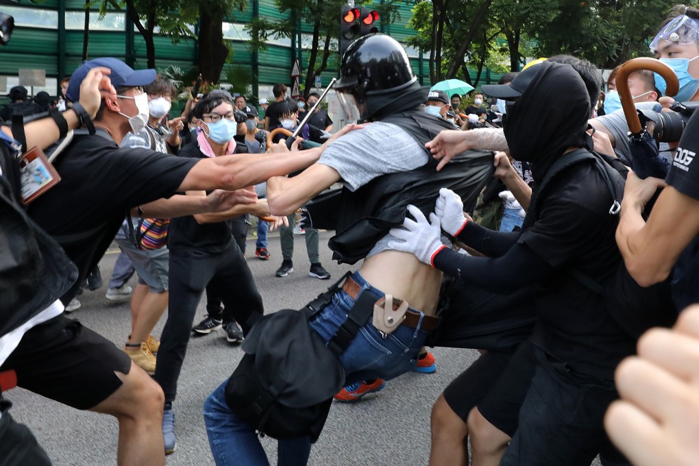 Protesters and police clash after the march in Sheung Shui against parallel trading. Photo: Dickson Lee