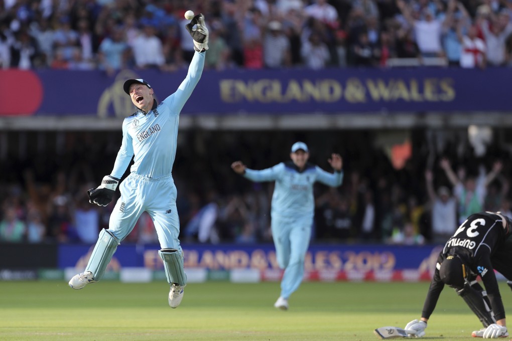England’s Jos Buttler celebrates after running out New Zealand’s Martin Guptill, right, with the last ball of the last over of the Cricket World Cup final. Photo: AP