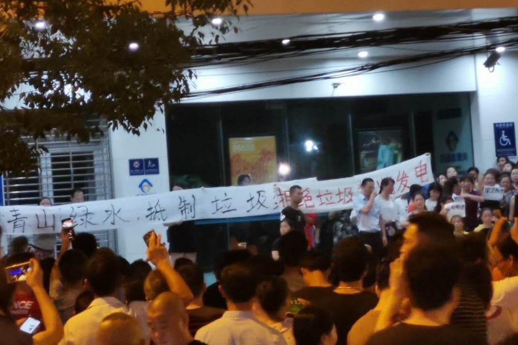 Thousands of people took to the streets in central China recently to march against a waste-to-energy plant that could be built next to residential areas in Yangluo, near Wuhan, the capital of Hubei province. Photo: Handout