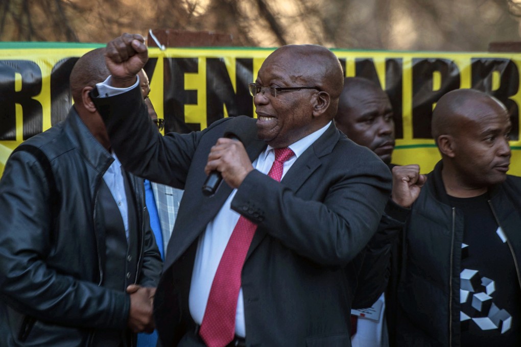 Former South African president Jacob Zuma (centre) addresses supporters in Johannesburg on Monday. Photo: AP