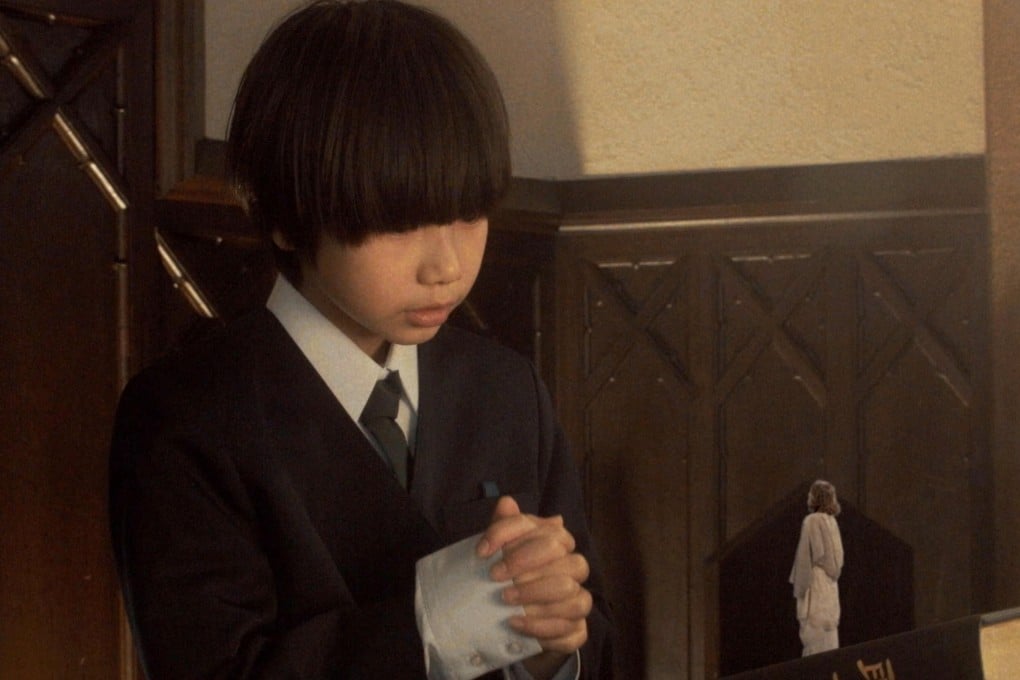 Yura Sato (left) and Australian comedian Chad Mullane as a miniature messiah in a still from Jesus.
