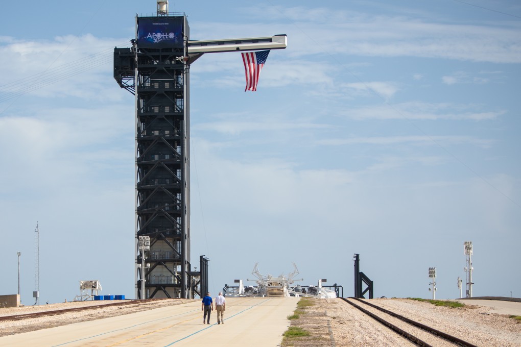 Astronaut Michael Collins (right) walks with Nasa’s Kennedy Space Centre director Robert Cabana at Launch Pad 39A on the 50th anniversary of the launch of the Apollo 11 mission in Cape Canaveral, Florida, on Tuesday. Photto: Nasa via Reuters