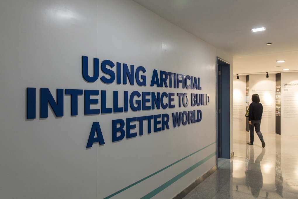 An employee walks past signage displayed inside iFlytek’s regional headquarters in Guangzhou, China. Photo: Bloomberg