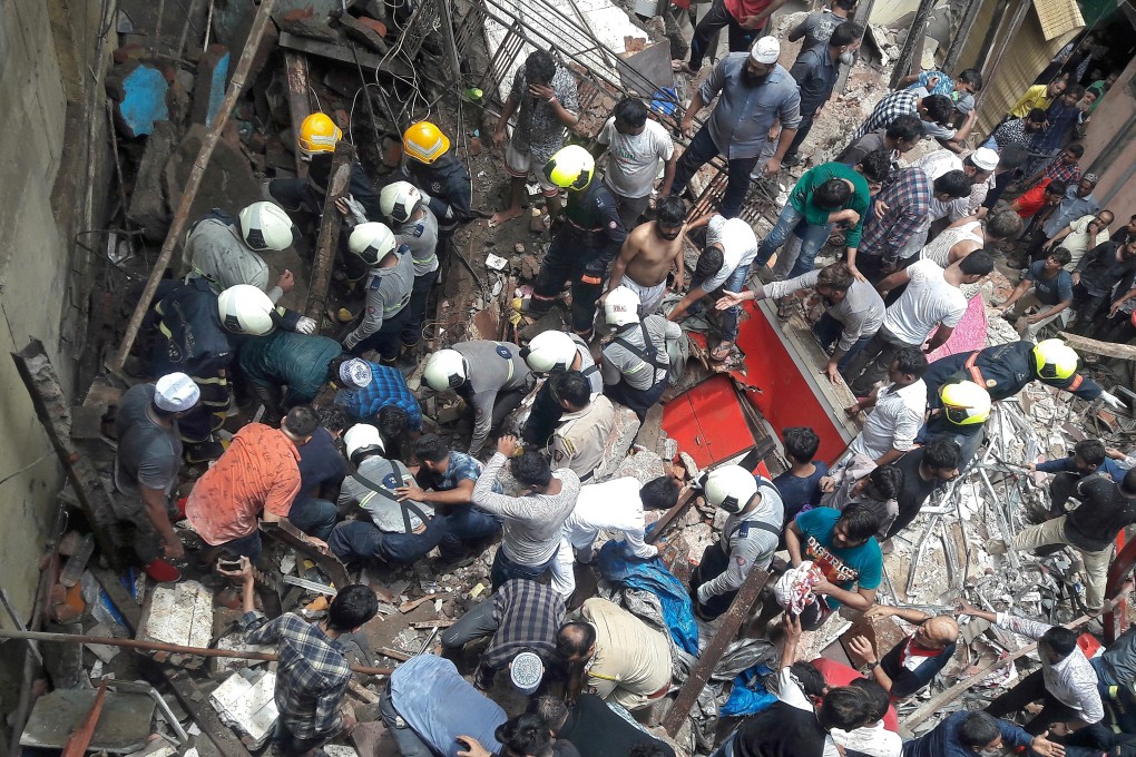 Rescuers and residents search for survivors at the site of a collapsed building in Mumbai on Tuesday. Photo: Reuters