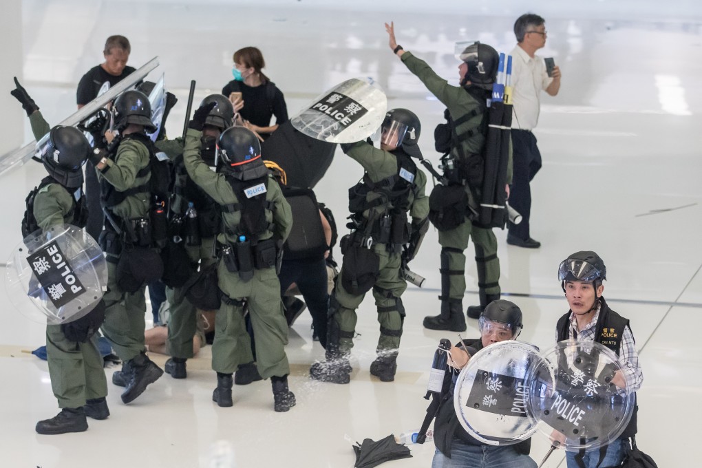 There were unprecedented scenes of violence in Sha Tin on Sunday as police and protesters fought in a mall. Photo: Bloomberg