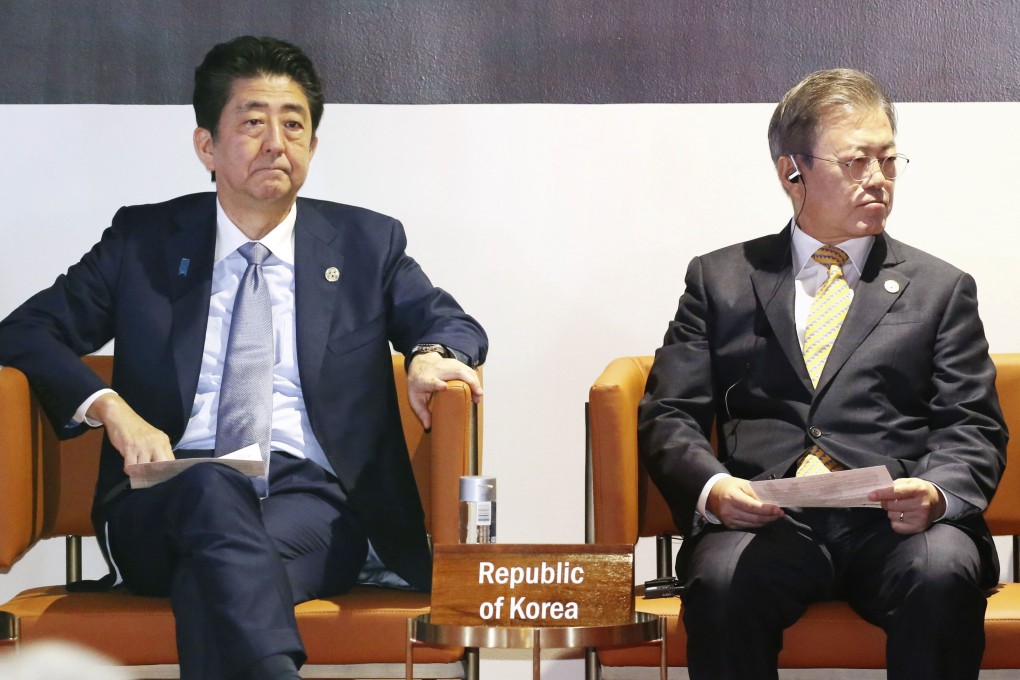 Japanese Prime Minister Shinzo Abe and South Korean President Moon Jae-in attend an event on the sidelines of the Asia-Pacific Economic Cooperation forum summit in Papua New Guinea in November 2018. Under the conservative Abe and progressive Moon, relations between Japan and South Korea have reached their lowest point in decades. Photo: Kyodo
