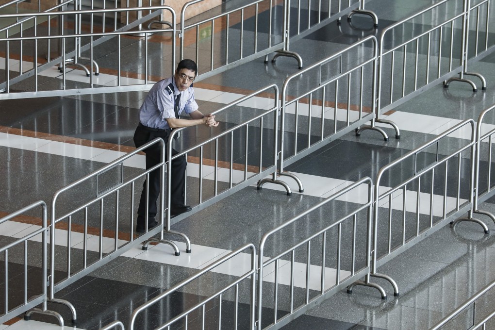 A policeman stands guard at the Hong Kong Convention and Exhibition Centre in Wan Chai, the venue of the book fair. Photo: Nora Tam