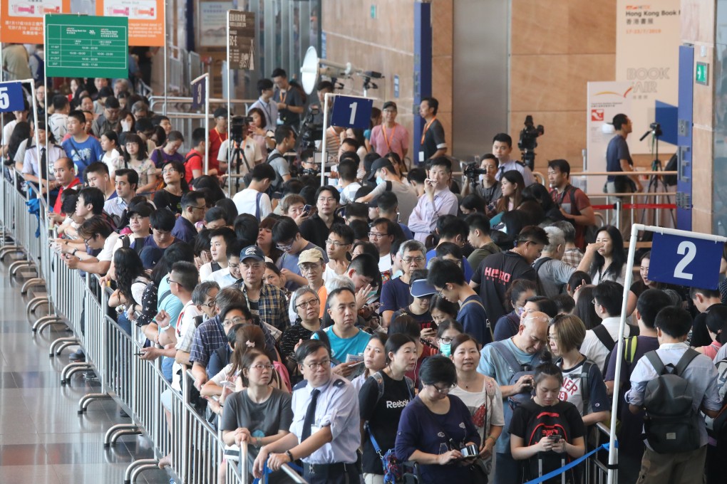Visitors queuing at the Hong Kong Convention and Exhibition Centre before the launch of the book fair. Photo: K.Y. Cheng