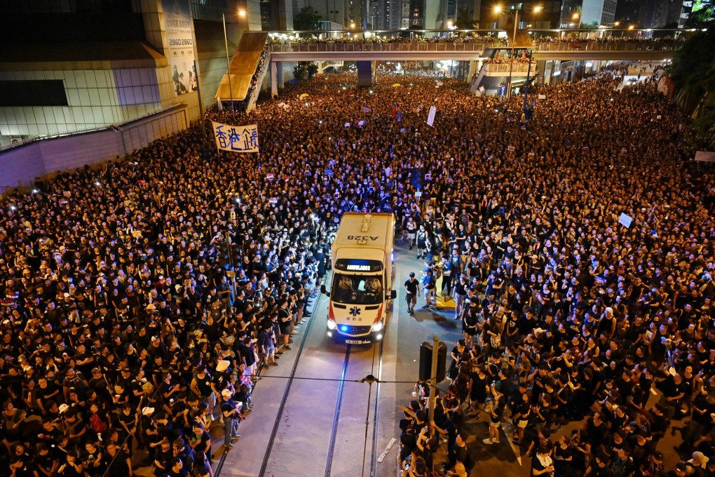 Crowds part to allow an ambulance through during a rally on June 16 against the Hong Kong government’s proposal to amend the city’s extradition laws that would allow the transfer of fugitives to mainland China. Photo: AFP