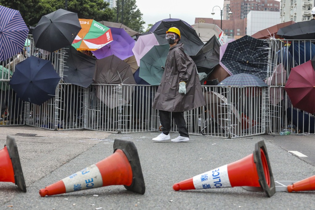 Protesters block a section of Yuen Wo Road in Sha Tin using umbrellas and fences after a peaceful march to demand the withdrawal of the extradition bill on July 14. Pitched battles between protesters and police in a shopping mall later that evening sent 22 people to hospital. Photo: Felix Wong