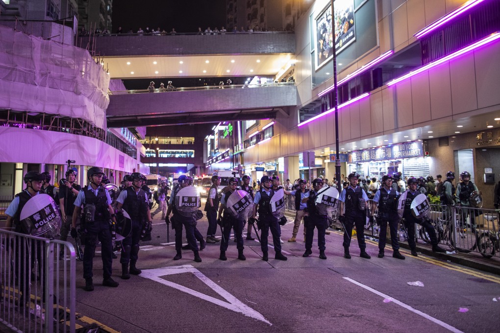 Riot police in a stand-off with protesters in Sha Tin on July 14. Photo: Bloomberg