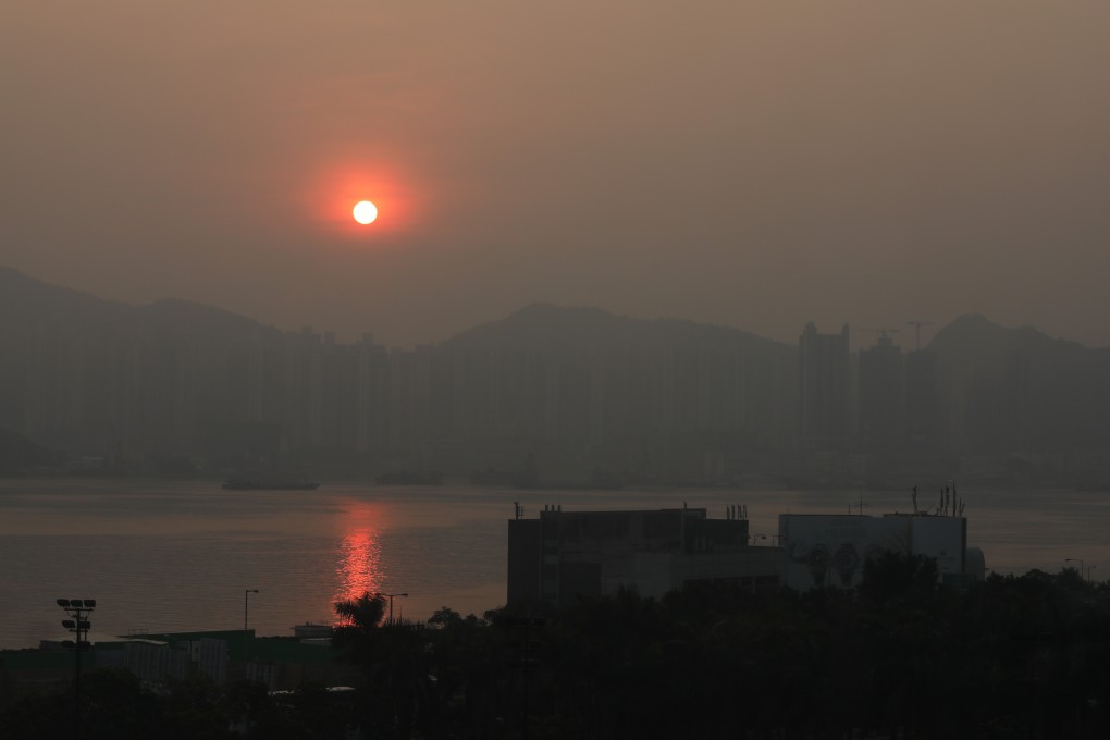 Buildings on Kowloon side are barely visible in a sunrise image taken from North Point on Thursday, as poor air quality continues to impact Hong Kong. Photo: Xiaomei Chen