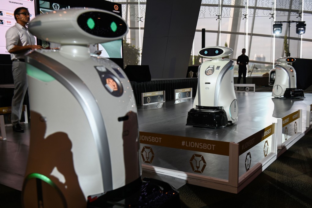 Autonomous cleaning robots move on a platform during their launch in Singapore. Photo: AFP