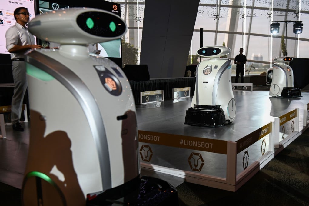 Autonomous cleaning robots move on a platform during their launch in Singapore. Photo: AFP