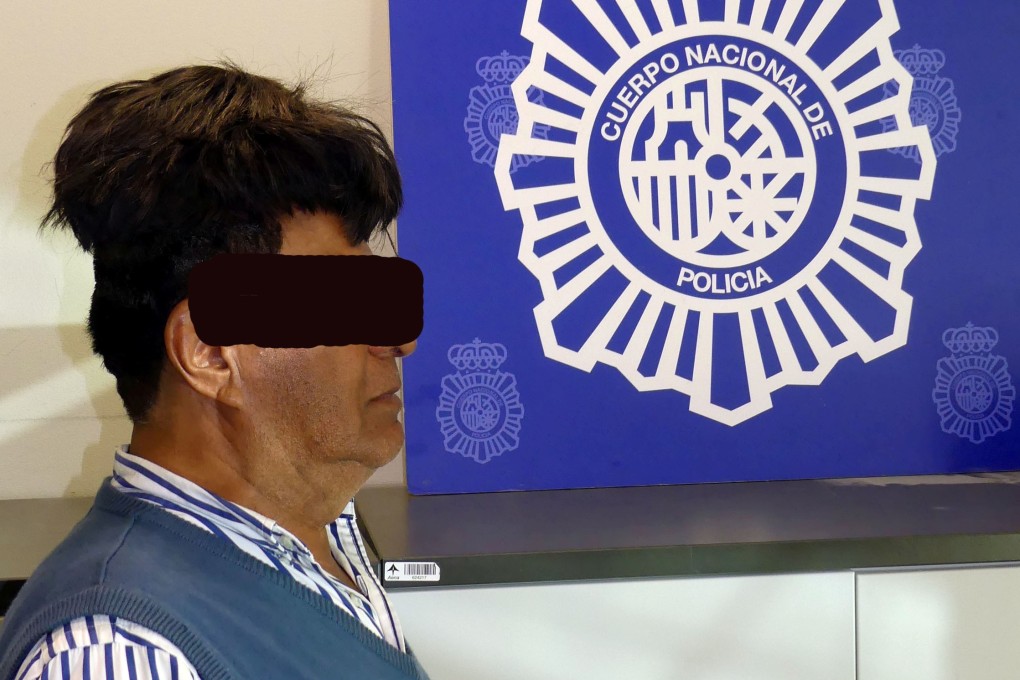 A man poses with drug package hidden under a toupee, in a picture released on Tuesday. Photo: Spanish National Police via Reuters