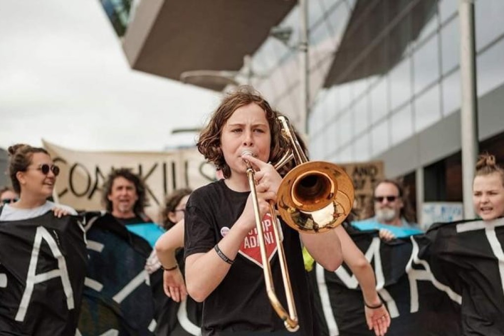 Zel Whiting from Australia takes part in a climate action strike. Young climate change activists across the Asia Pacific have joined a global movement demanding government action and the declaration of climate emergencies.