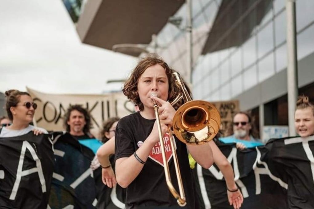 Zel Whiting from Australia takes part in a climate action strike. Young climate change activists across the Asia Pacific have joined a global movement demanding government action and the declaration of climate emergencies.