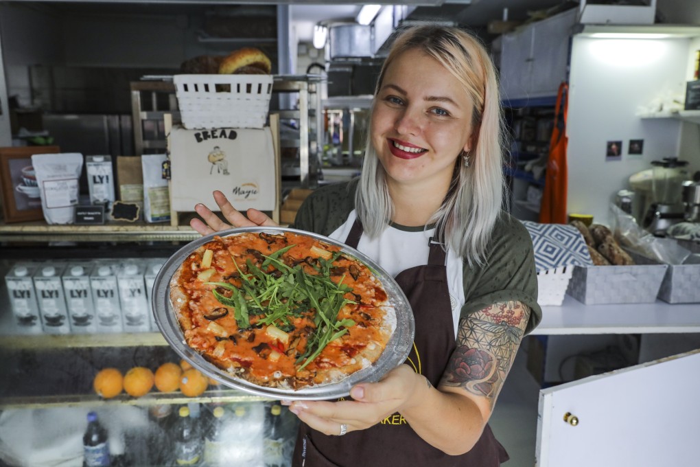 Mayse Artisan Bakery owner Elina Strelita-Strele with the vegan Hot Hawaii pizza, in Tai Po. Photo: May Tse
