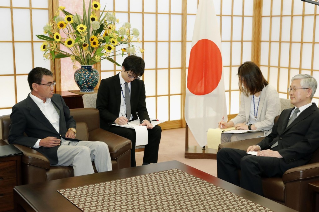 Japanese Foreign Minister Taro Kono, left, holds a meeting with South Korean Ambassador to Japan Nam Gwan Pyo, right, at the Foreign Ministry in Tokyo. Photo: Kyodo