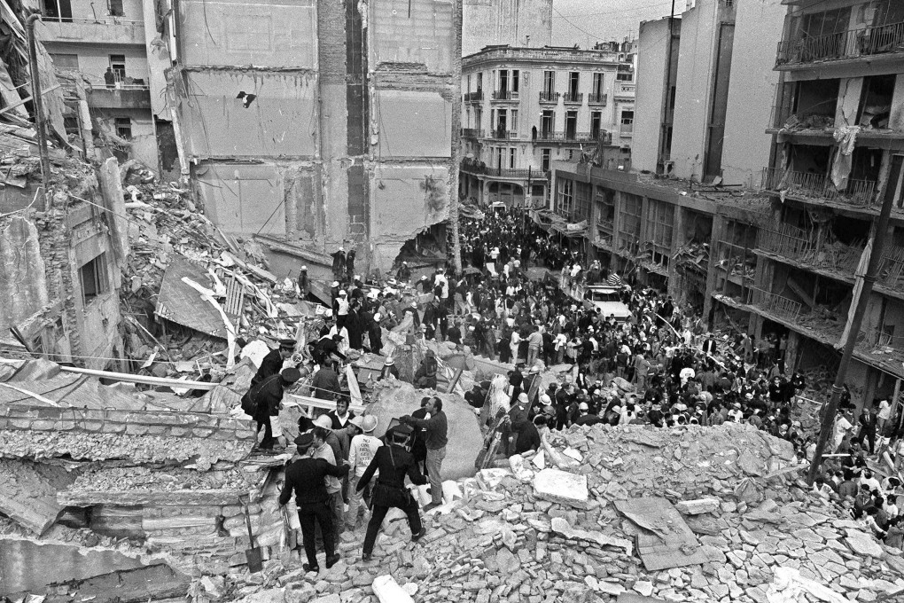 Rescuers search through the rubble of the Buenos Aires Jewish community centre blown up on July 18, 1994. Photo: AFP