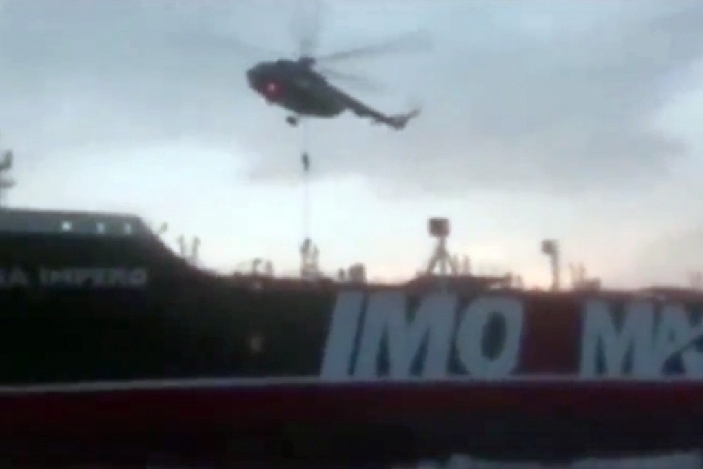 A screen grab of a video provided by Iran's Revolutionary Guard Corps showing its members boarding the British-flagged tanker Stena Impero. Photo: EPA