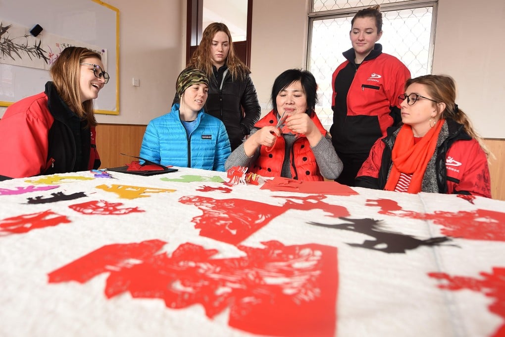 International students in China experience the traditional art of paper-cutting as part of their introduction to Chinese culture. Province. Photo: Alamy