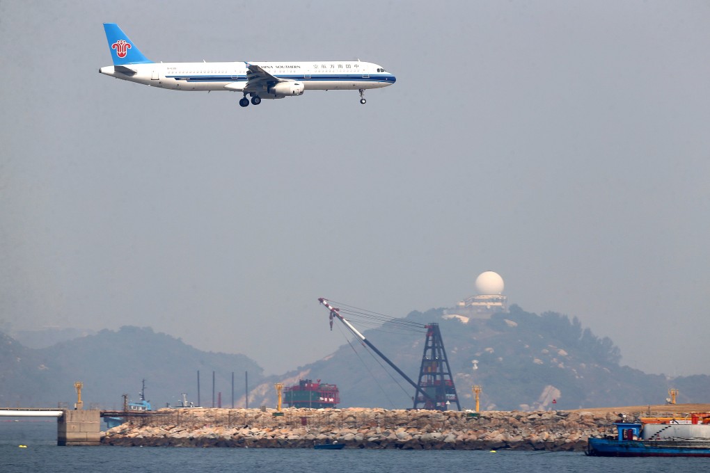 A China Southern Airlines plane lands at Hong Kong International Airport. The carrier last year posted a 51.4 per cent decline in net profit, on the back of higher fuel costs. Photo: Sam Tsang