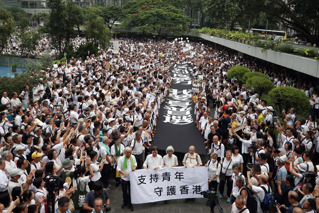 Thousands of mostly elderly Hongkongers march in support of young anti-extradition protesters, calling for the withdrawal of the extradition bill and demanding universal suffrage, in Hong Kong on July 17. Photo: Winson Wong