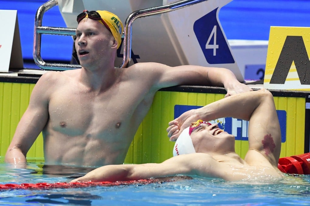 China's Sun Yang reacts next to Australia's Clyde Lewis after winning the final of the men's 200m freestyle. Photo: AFP