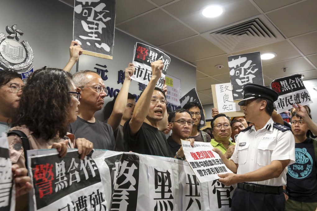 Protesters demonstrate at Yuen Long police station the day after a group of thugs attacked passengers in a train station. Photo: Felix Wong