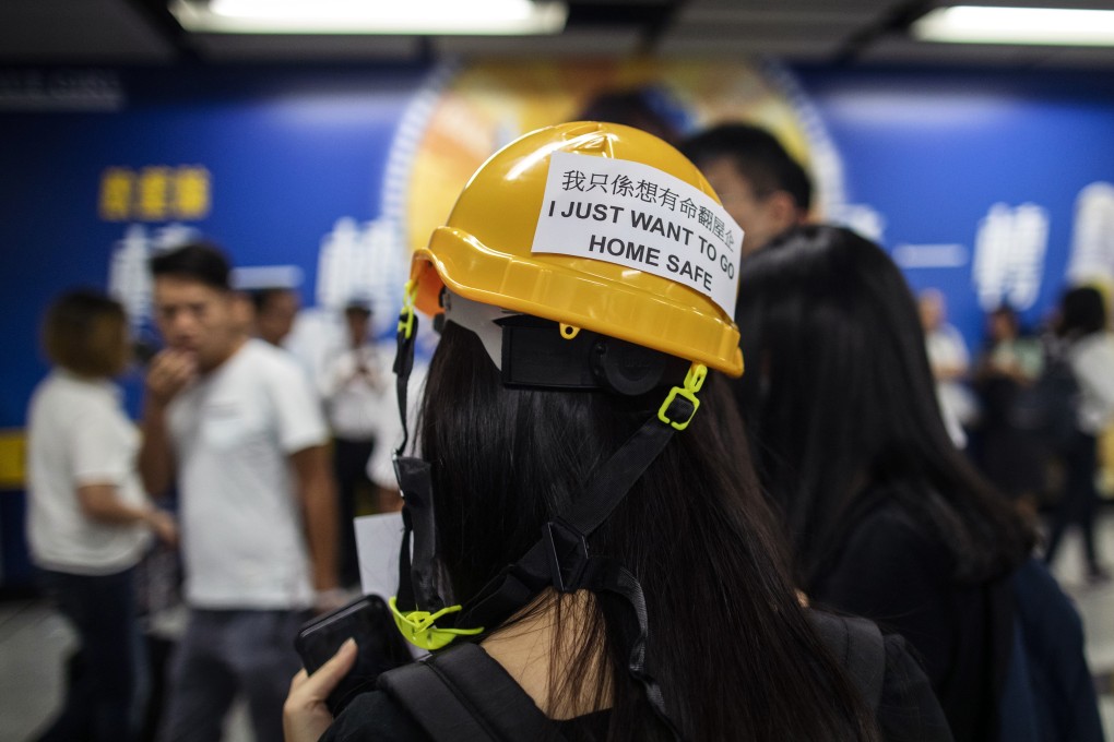 A demonstrator’s hard hat spells out her message, as protesters disrupt train services at Admiralty MTR station during the morning rush hour on July 24. The protest was a response to the violence at Yuen Long MTR station late on July 21, when a mob of men in white T-shirts brutally attacked passengers, passers-by and those returning from an earlier demonstration in Central. Photo: Bloomberg