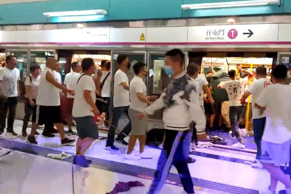 A mob of men in white T-shirts attack black-clad protesters and passengers at Yuen Long MTR Station on Sunday night. A protest march is planned for this coming Saturday, to end at the station. Photo: Handout