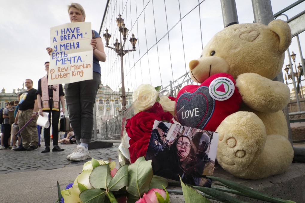 Dozens of demonstrators have held solo pickets in St. Petersburg to commemorate a political and LGBT rights activist who was killed over the weekend. Photo: AP