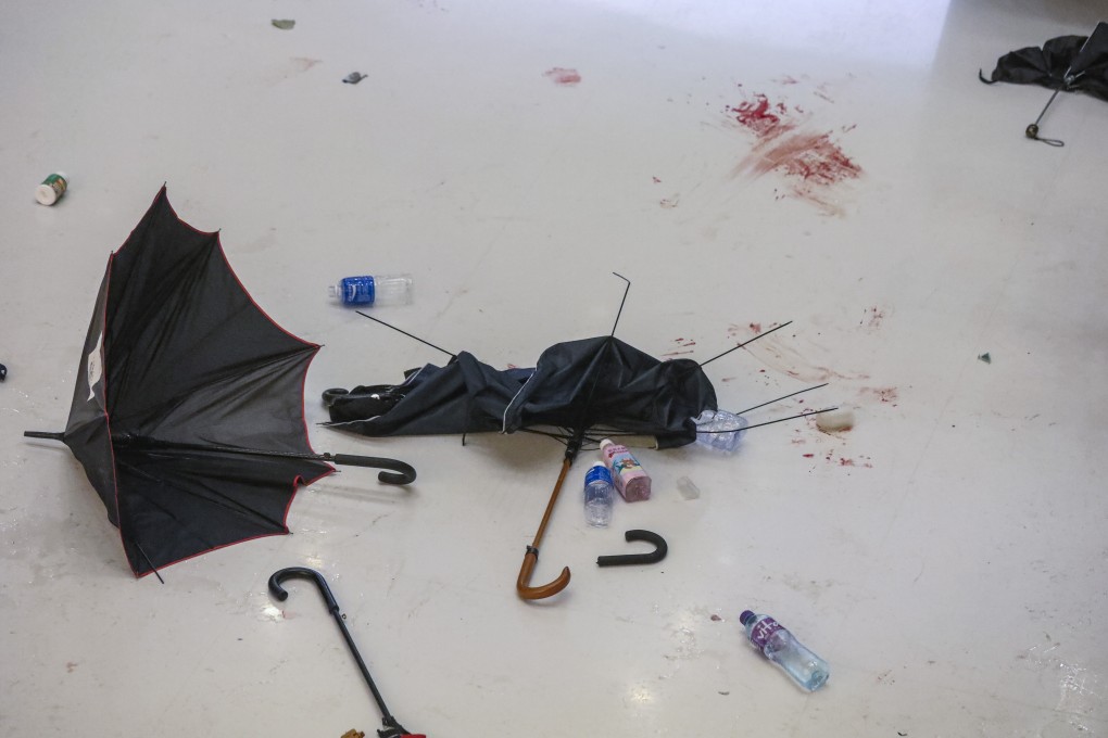 Broken umbrellas and blood stains on the floor tell of the violent scuffles between police and anti-extradition protesters in a Sha Tin shopping mall on July 14. Photo: Dickson Lee