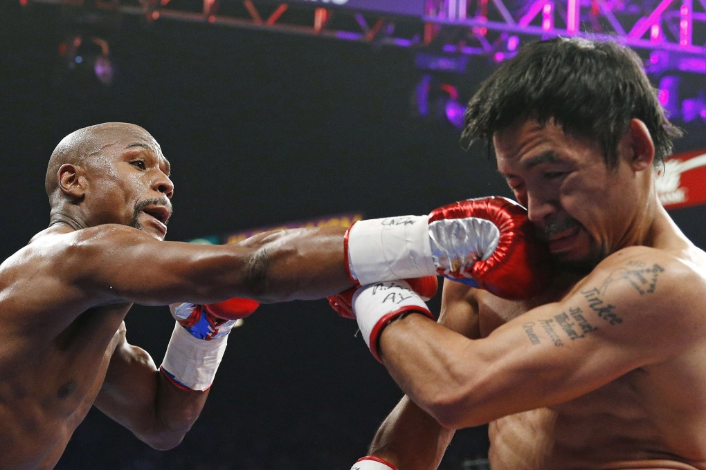 Floyd Mayweather Jnr connects with a right to the head of Manny Pacquiao during their 2015 megafight in Las Vegas. Photo: AP