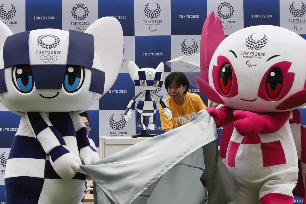 Tokyo 2020 Olympic mascot Miraitowa (left) and Tokyo 2020 Paralympic mascot Someity (right) unveil the Tokyo 2020 mascot robot Miraitowa at a ceremony to mark ‘One Year To Go Tokyo 2020’. Photo: EPA